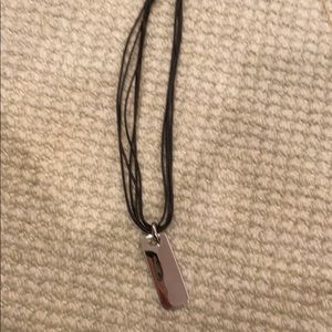 Silver pendant necklace with letter strand